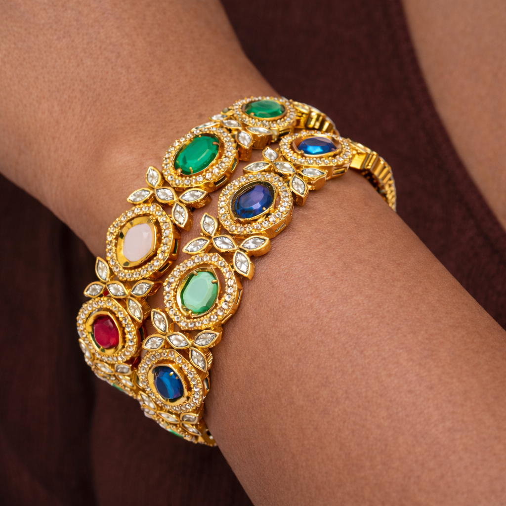 Ornate gold bangles with vibrant gemstones